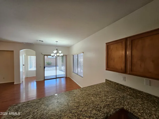 a view of livingroom with hardwood floor and hallway