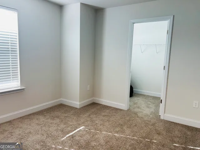 an empty room with a empty space and a window