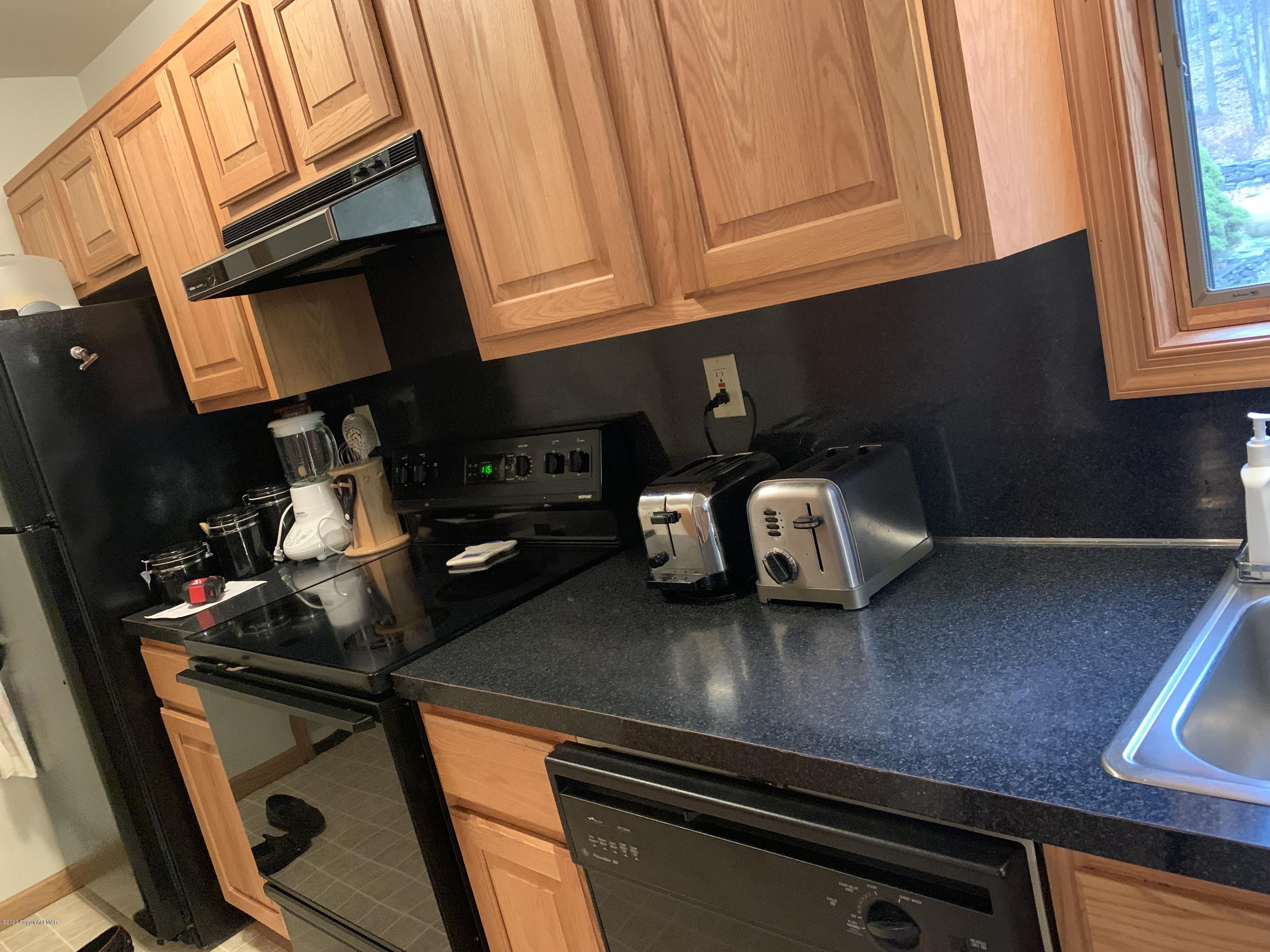 6493 Decker Road Bushkill, PA 18324 - Photo 13 of 81 a kitchen with a sink cabinets and appliances