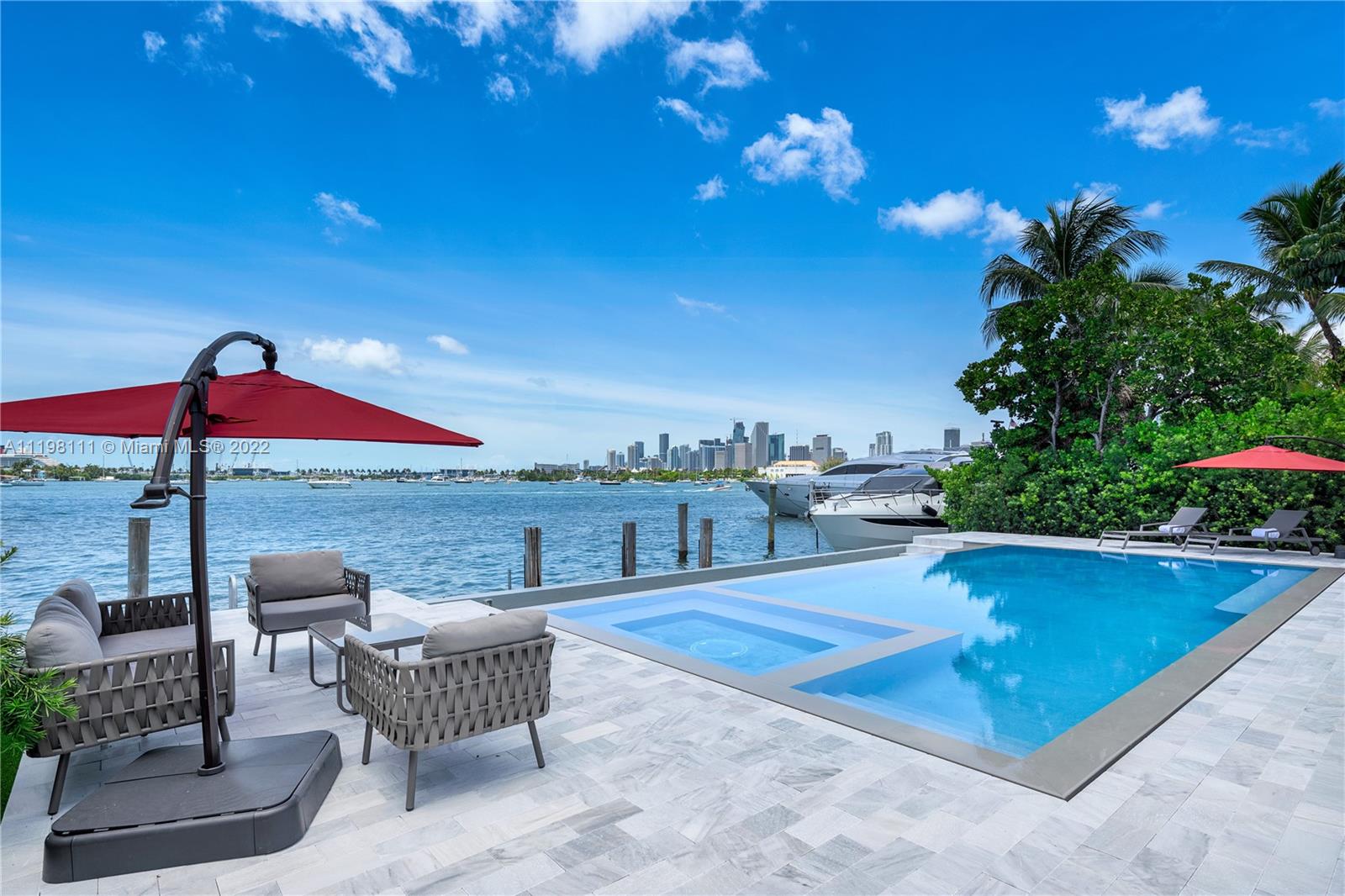 1300 South Venetian Way Miami Beach, FL 33139 - Photo 1 of 32 a view of a terrace with couches and table