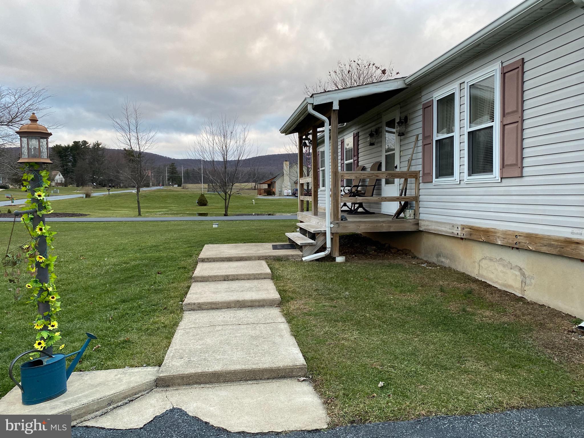 51 Faust North Road Bethel, PA 19507 - Photo 14 of 14 Covered fron porch and concrete service walk.