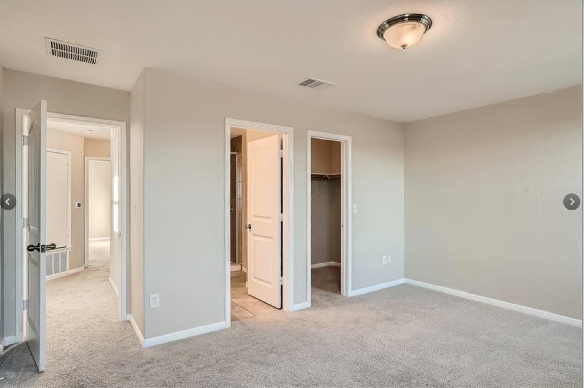 304 Cane River Road Pflugerville, TX 78660 - Photo 17 of 31 A spacious bedroom with plush carpeting features an attached closet and easy access to a full bathroom.