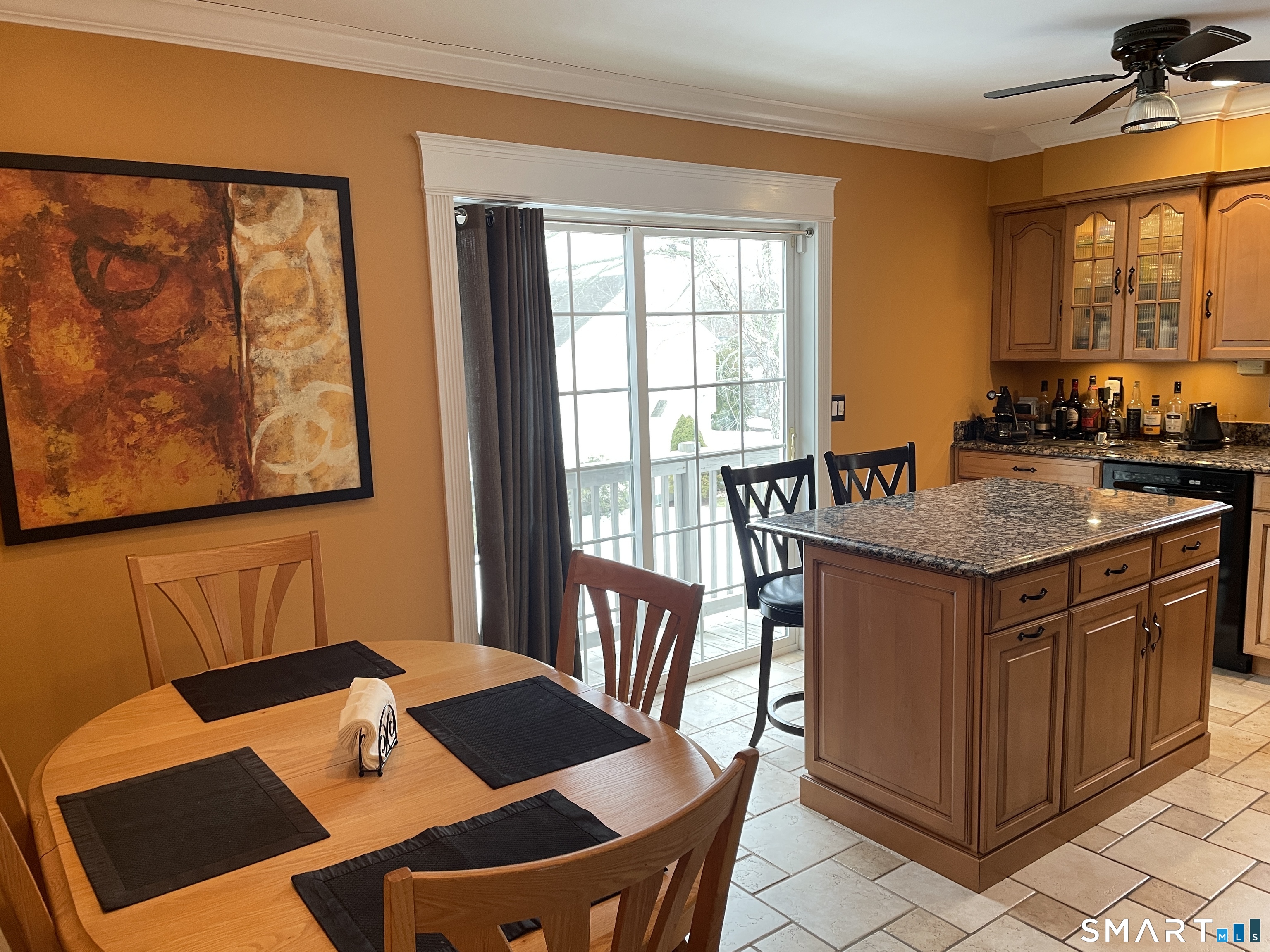 2304 Durham Road Madison, CT 06443 - Photo 4 of 23 Dining and kitchen enjoy sun filled space with doors to decks