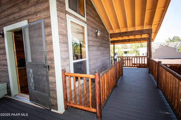 a view of wooden balcony with outdoor space