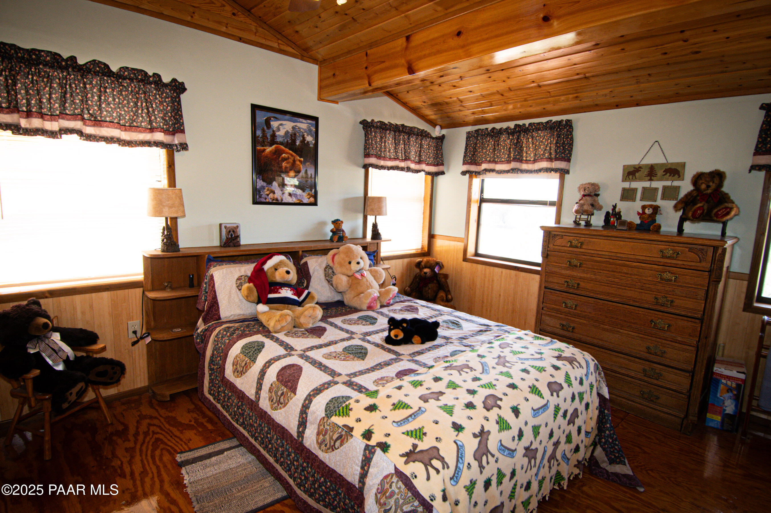 33744 Gallina Road Seligman, AZ 86337 - Photo 22 of 38 a bedroom with a bed and wooden floor