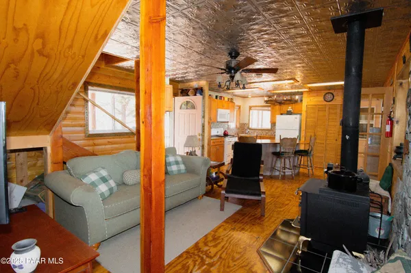 a view of living room with furniture and floor to ceiling window