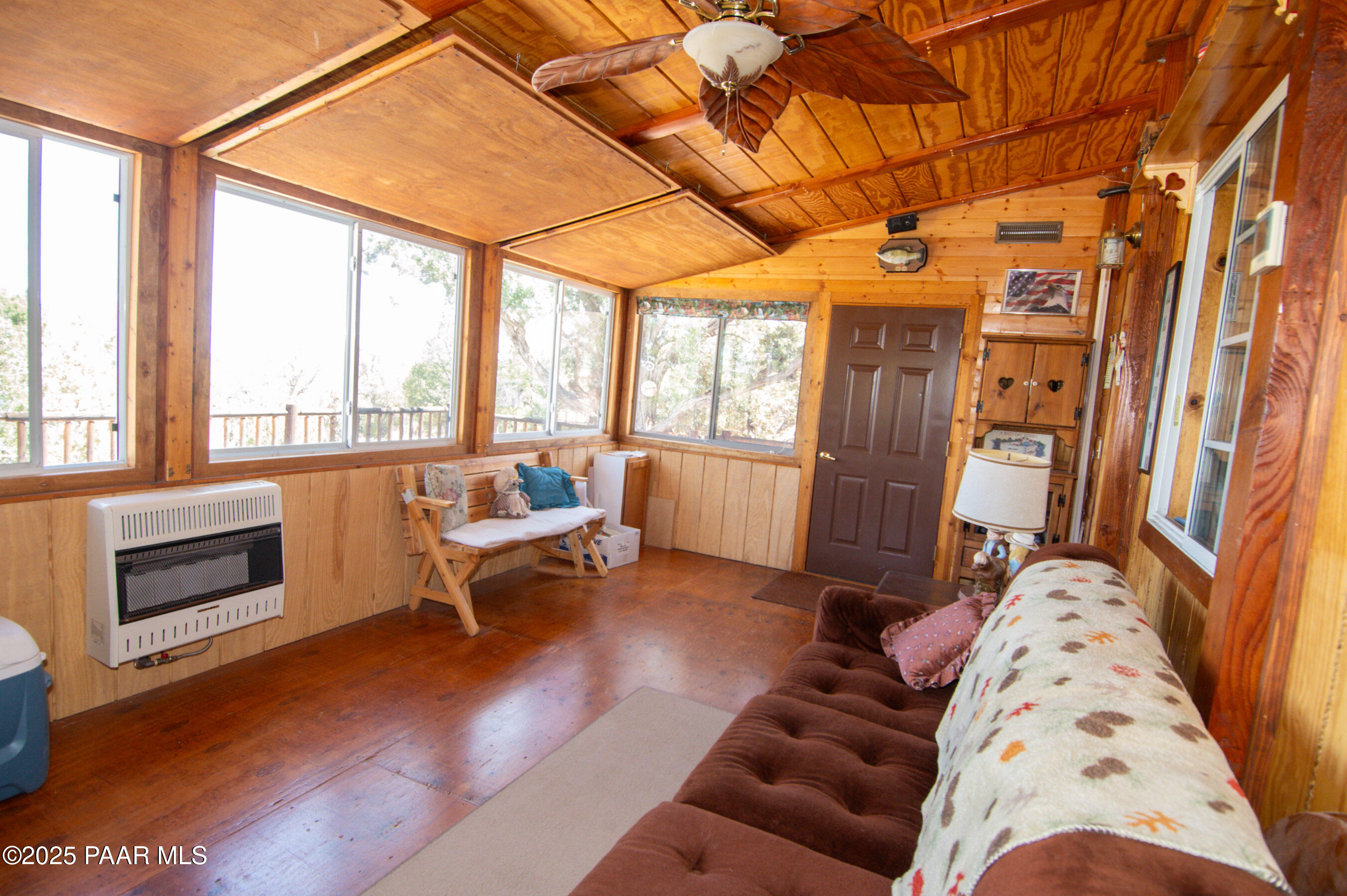 33744 Gallina Road Seligman, AZ 86337 - Photo 9 of 38 a living room with furniture and a fireplace