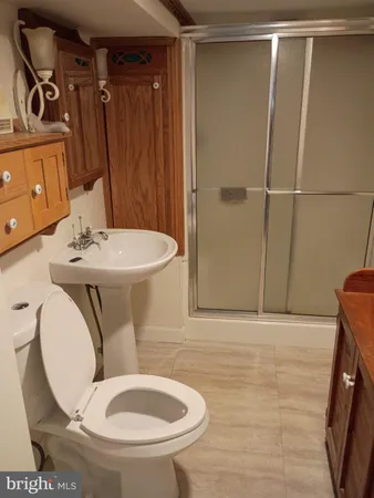 a close view of a sink and dishwasher in a bathroom
