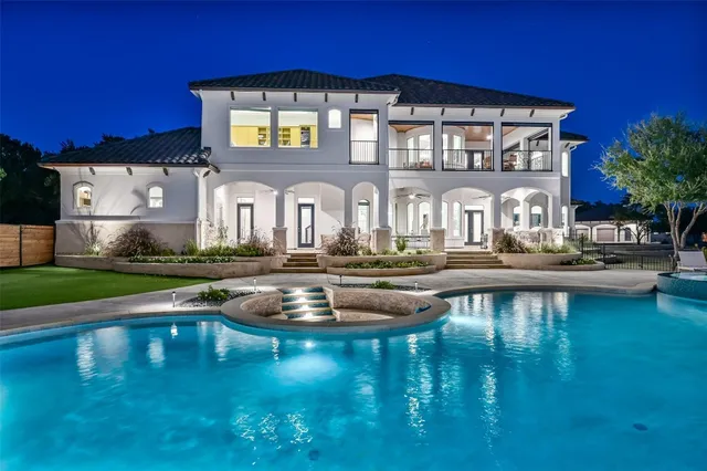 a bedroom with a bed and a ceiling fan