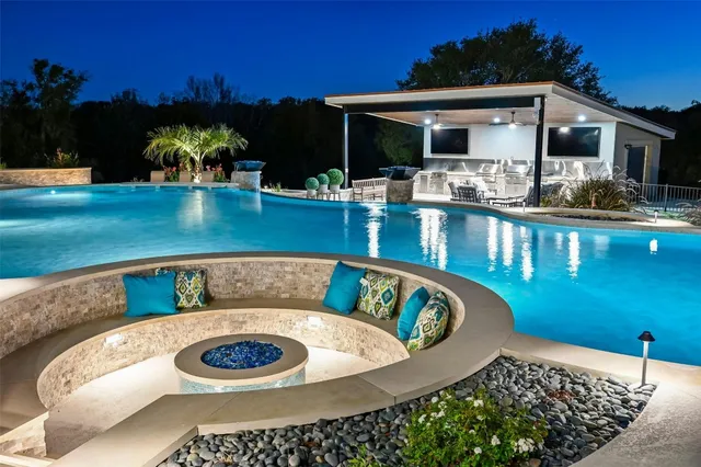 a bathroom with a toilet a sink and a shower curtain