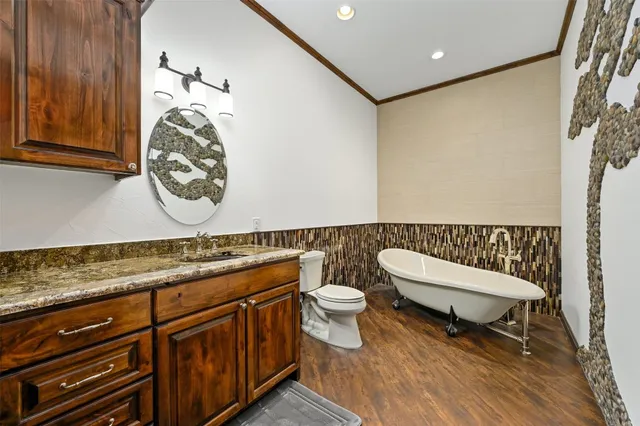 a spacious bedroom with a bed window and a flat tv screen