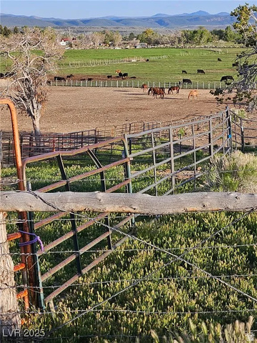 29 R7w S4, Unit 22 Beaver, UT 84713 - Photo 2 of 10 View of yard featuring an outdoor riding arena, a view of countryside, and a mountain view