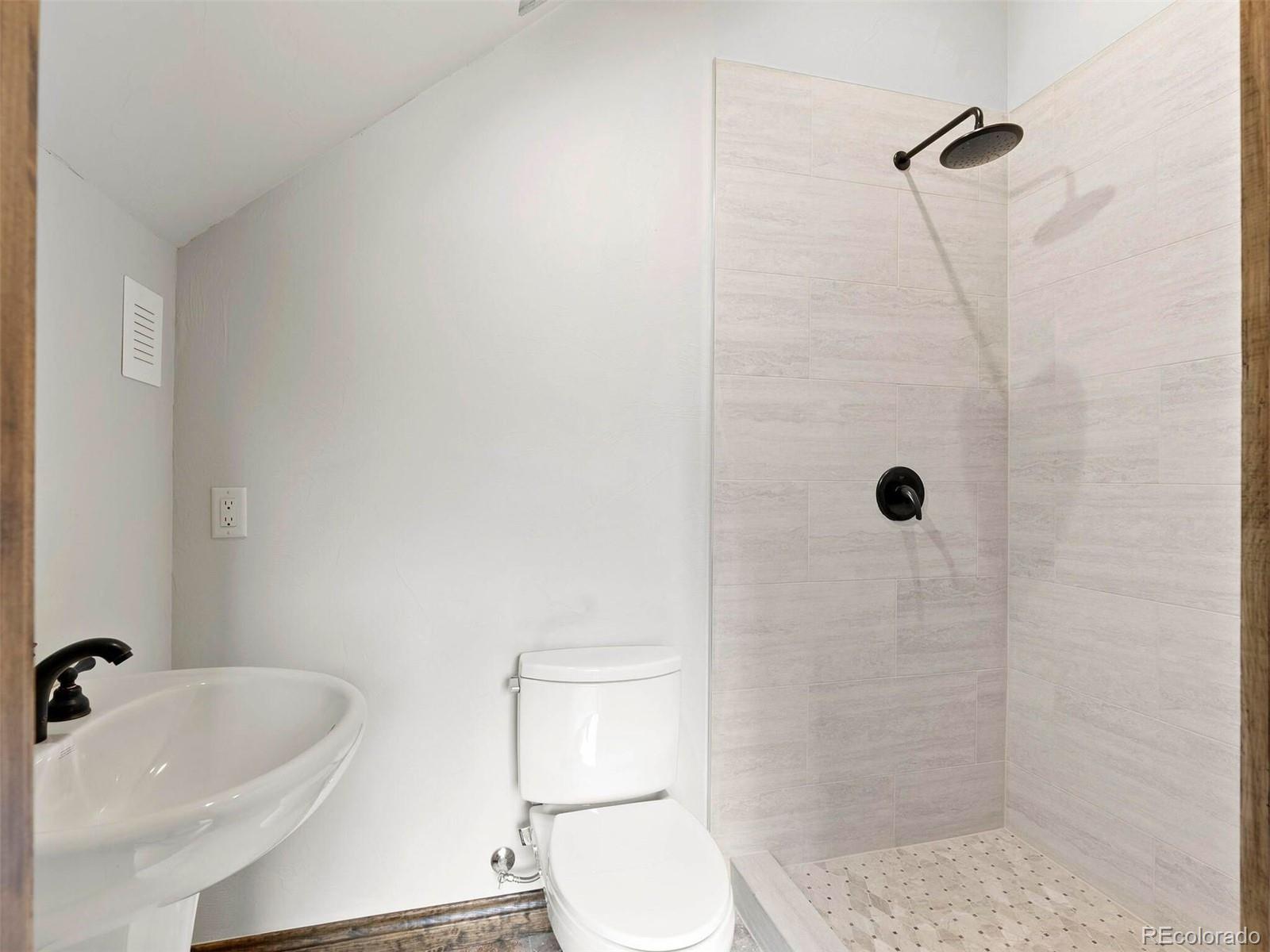 733 Rainbow Road Idaho Springs, CO 80452 - Photo 20 of 47 a bathroom with a sink a toilet and shower