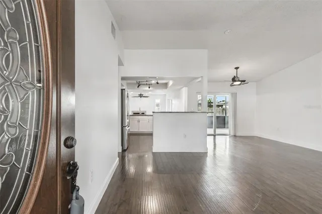 a view of a kitchen with wooden floor
