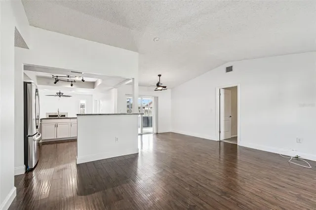 a view of a kitchen with wooden floor