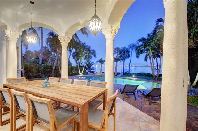 a view of a dining room with furniture and chandelier