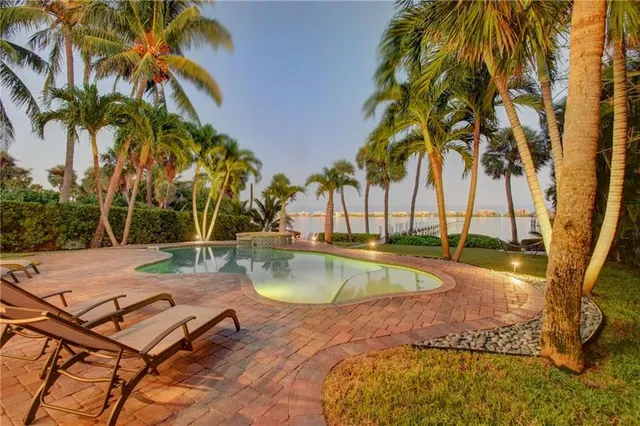 a view of a garden with a building in the background