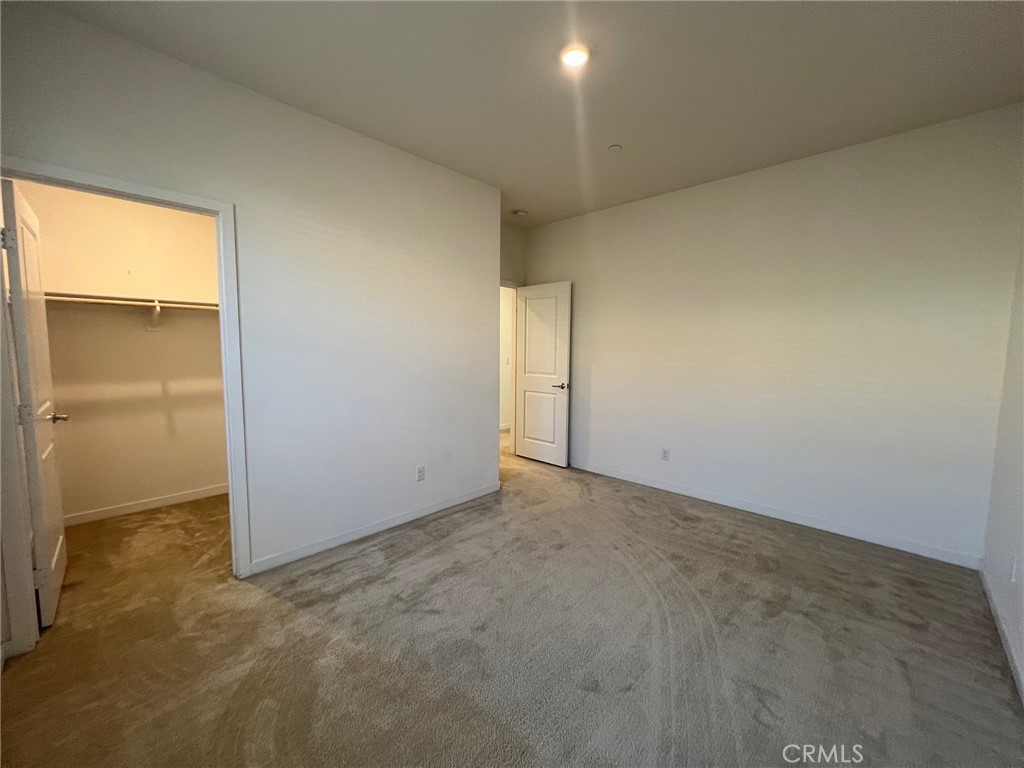 6986 Silverado Street Chino, CA 91710 - Photo 13 of 23 an empty room with a empty space and a window