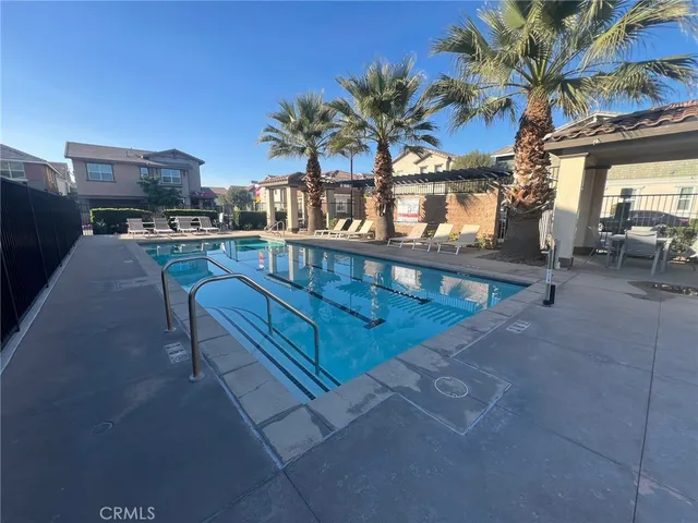 a view of a swimming pool with a patio