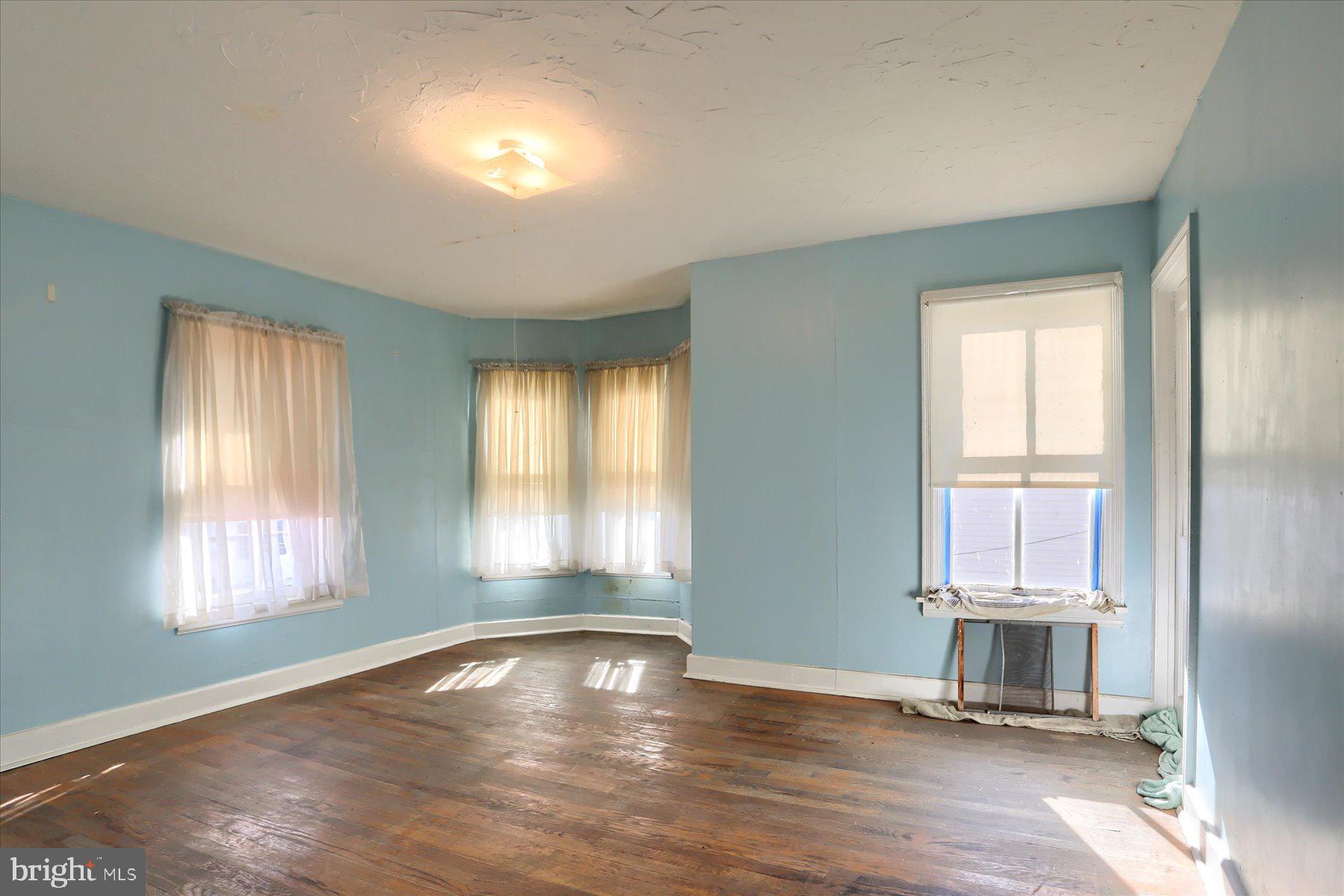 283 North Locust Point Road Mechanicsburg, PA 17050 - Photo 27 of 33 an empty room with wooden floor and windows