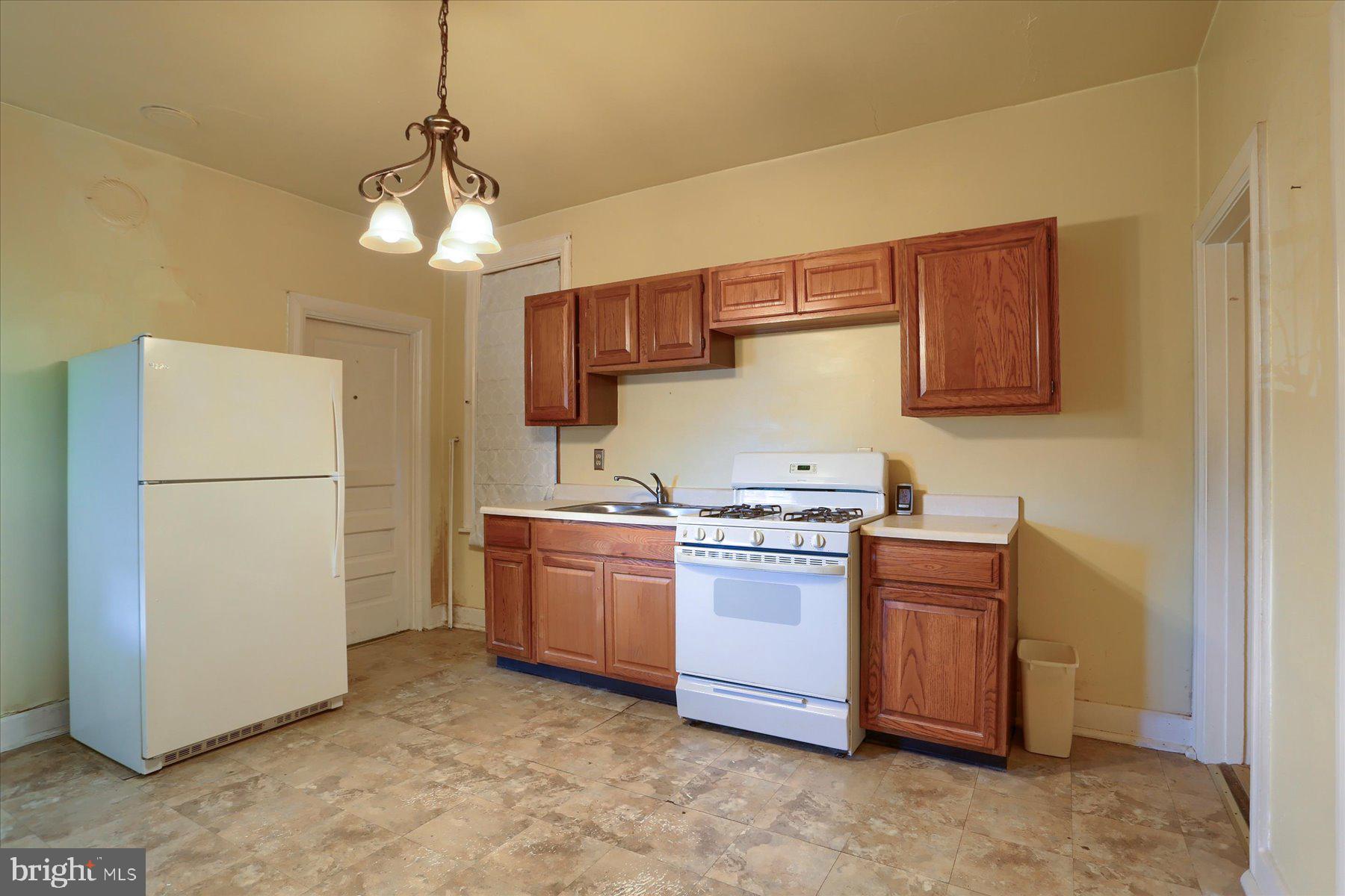 283 North Locust Point Road Mechanicsburg, PA 17050 - Photo 4 of 33 a kitchen with stainless steel appliances granite countertop a refrigerator a stove a sink dishwasher and a refrigerator