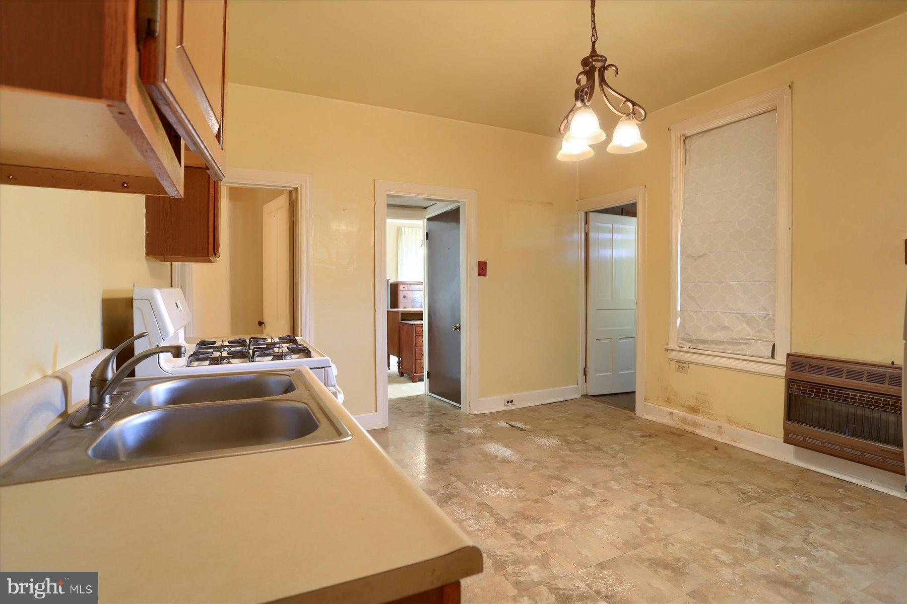 283 North Locust Point Road Mechanicsburg, PA 17050 - Photo 5 of 33 a view of a kitchen with a sink and a refrigerator