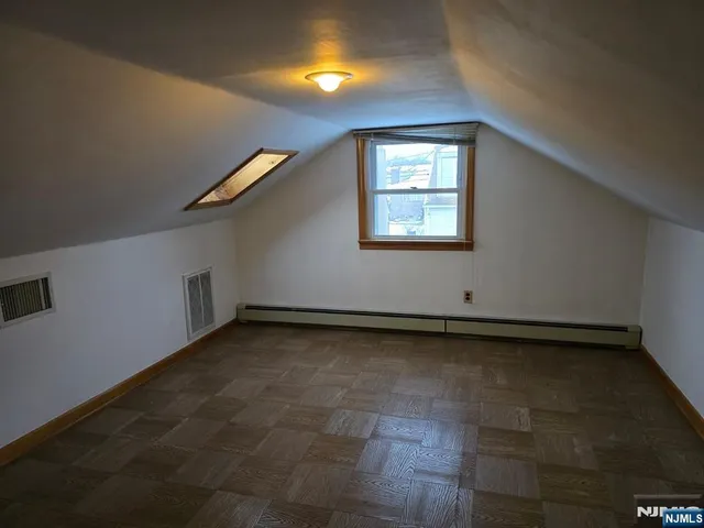 a view of a hallway with a window