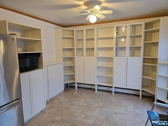 a view of an empty room with a fireplace