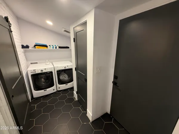 a utility room with dryer and washer
