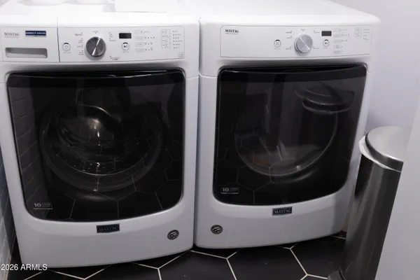 a utility room with dryer and washer