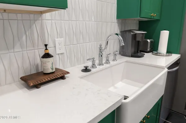 a bathroom with a sink vanity and toilet