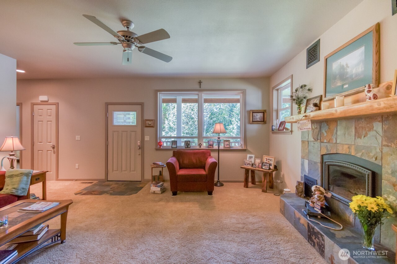 163 Prawn Road Port Angeles, WA 98363 - Photo 11 of 40 a living room with furniture and a fireplace