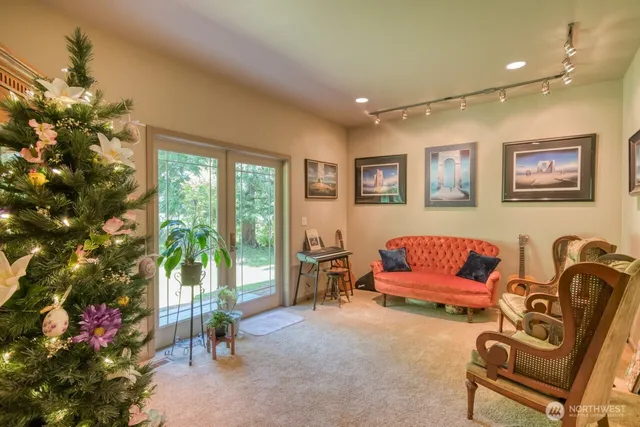 a living room with furniture and a potted plant