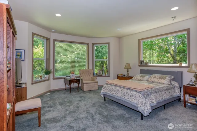 a bedroom with a bed and a couch