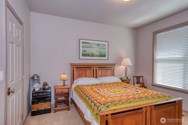 a bedroom with a bed and a dresser