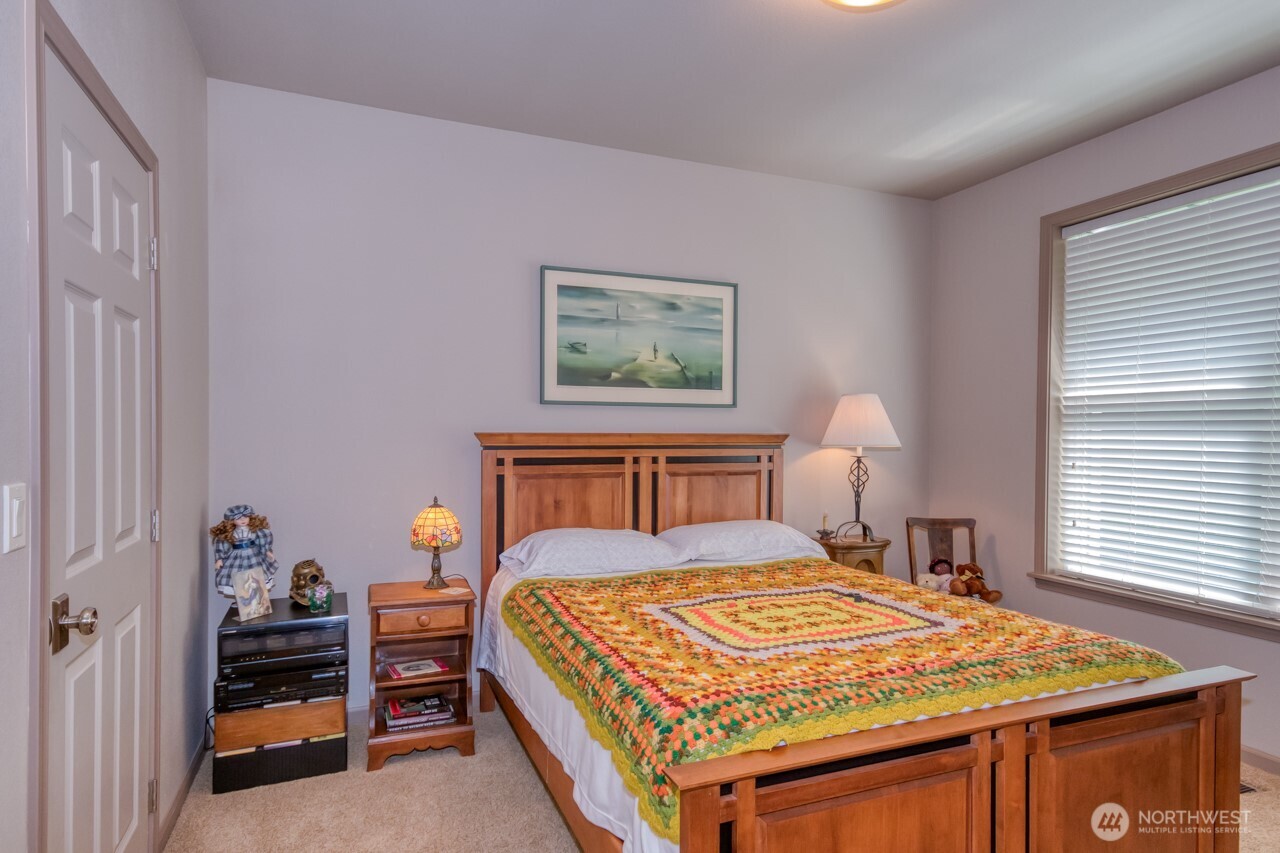 163 Prawn Road Port Angeles, WA 98363 - Photo 21 of 40 a bedroom with a bed and a dresser