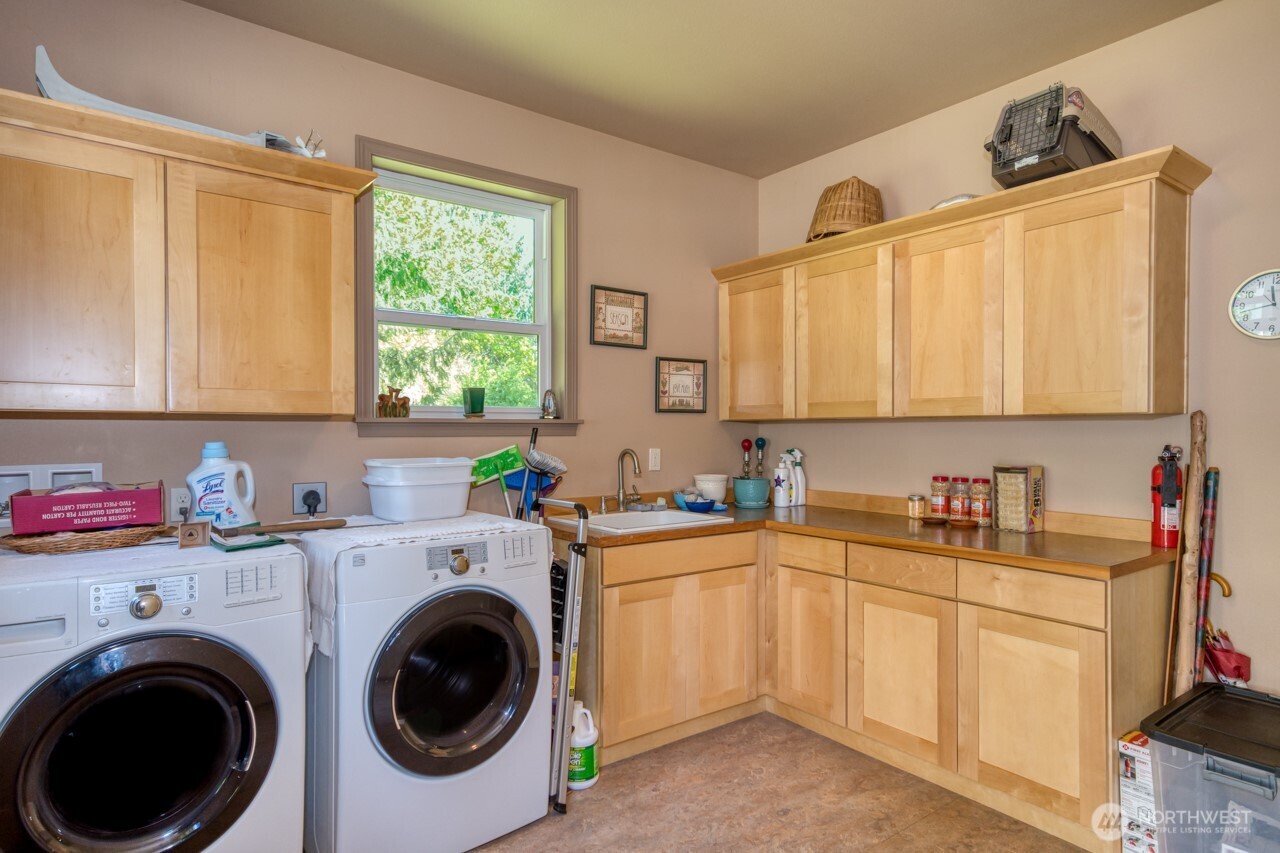 163 Prawn Road Port Angeles, WA 98363 - Photo 23 of 40 a view of a kitchen with sink washer and dryer
