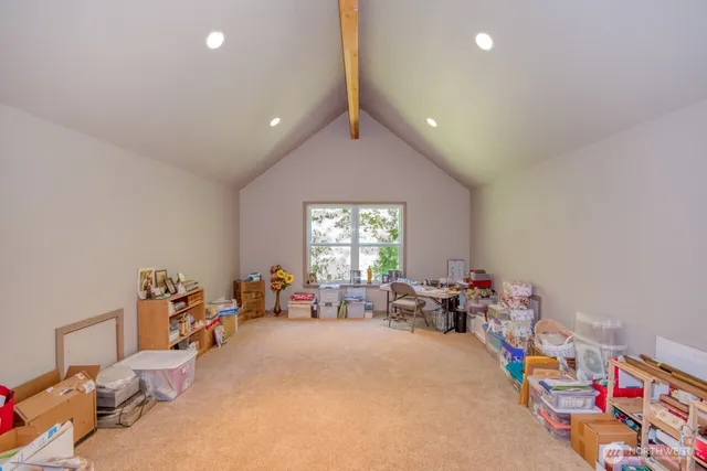 a bed room with furniture and a window