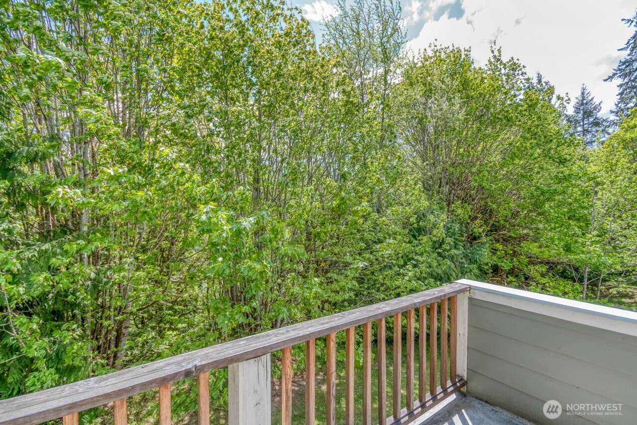 163 Prawn Road Port Angeles, WA 98363 - Photo 26 of 40 a balcony with trees in the background