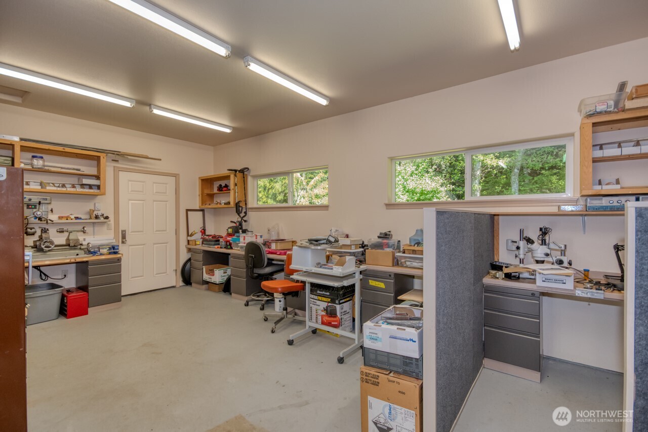 163 Prawn Road Port Angeles, WA 98363 - Photo 28 of 40 a view of a livingroom with workspace and a window