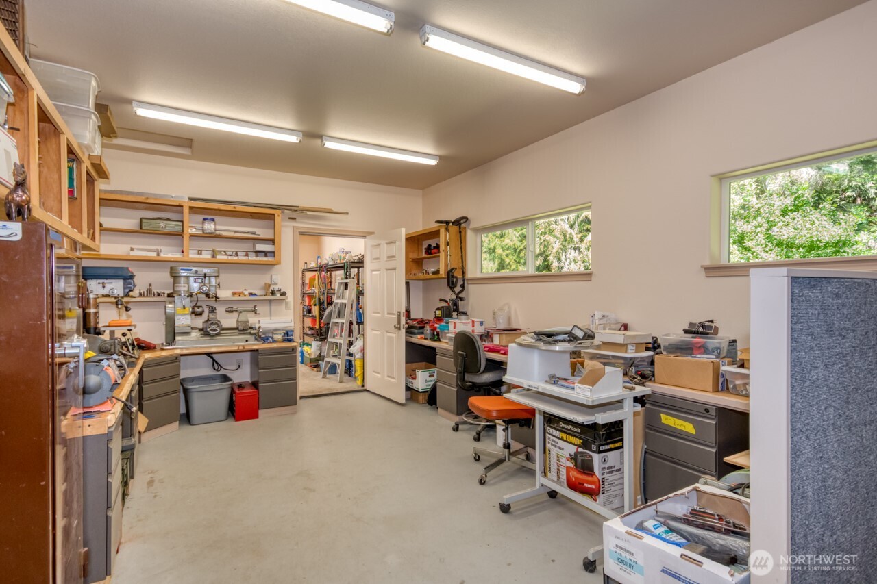 163 Prawn Road Port Angeles, WA 98363 - Photo 29 of 40 a view of a workspace with furniture and a livingroom