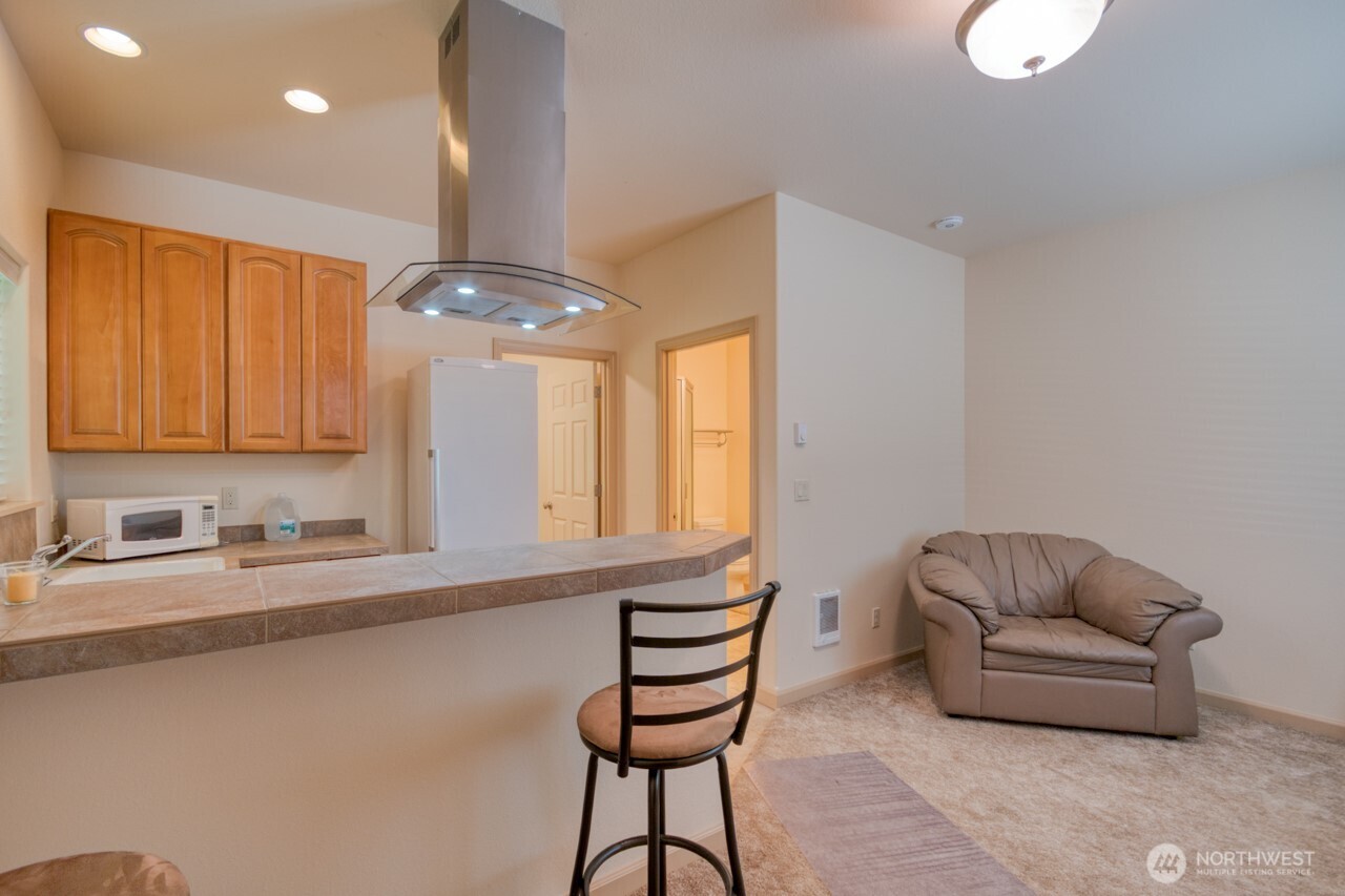 163 Prawn Road Port Angeles, WA 98363 - Photo 30 of 40 a living room with furniture and a chandelier
