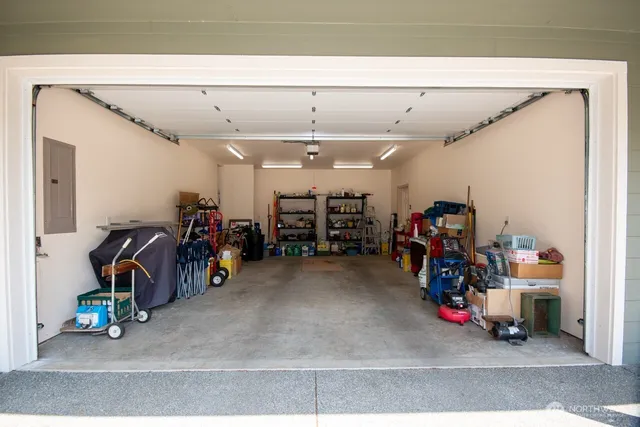 a view of a garage with a bike and car