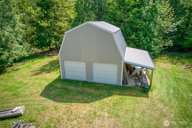 an aerial view of a house with lots of trees