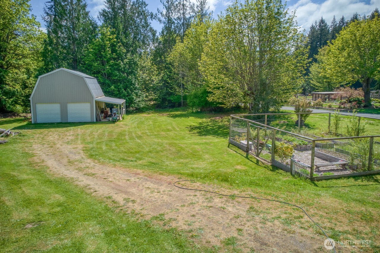 163 Prawn Road Port Angeles, WA 98363 - Photo 4 of 40 a backyard of a house with lots of green space