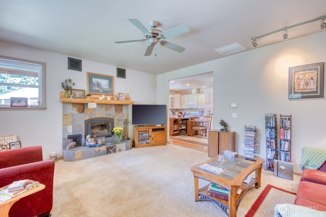 163 Prawn Road Port Angeles, WA 98363 - Photo 10 of 40 a living room with furniture and a fireplace