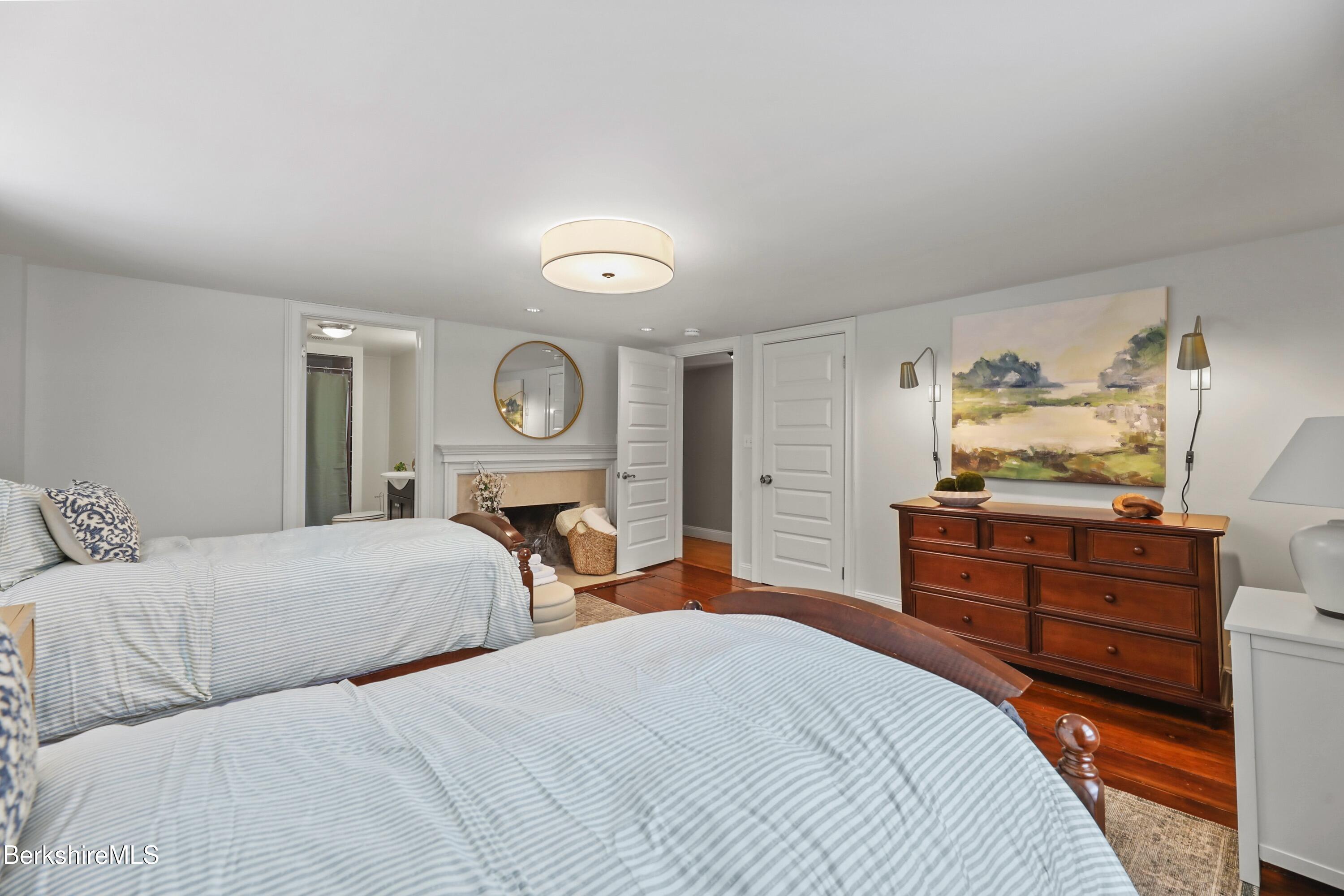 1 Devon Road Stockbridge, MA 01262 - Photo 33 of 58 a bedroom with a bed and closet with mirror