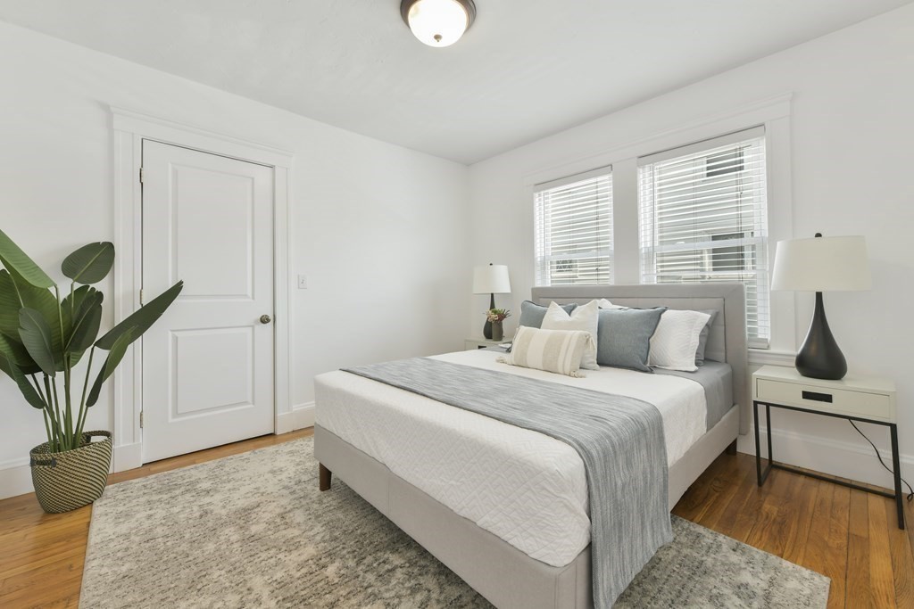 64 Parmenter Road, Unit 1 Waltham, MA 02453 - Photo 14 of 25 a bedroom with bed and window