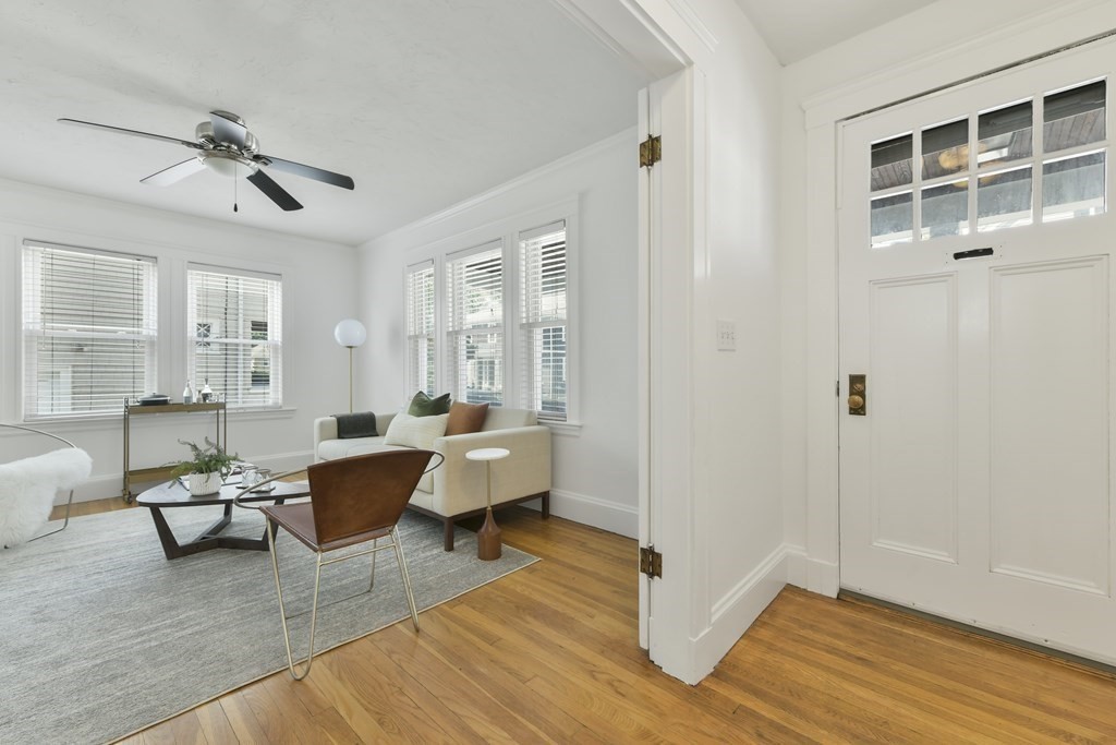 64 Parmenter Road, Unit 1 Waltham, MA 02453 - Photo 2 of 25 a living room with furniture