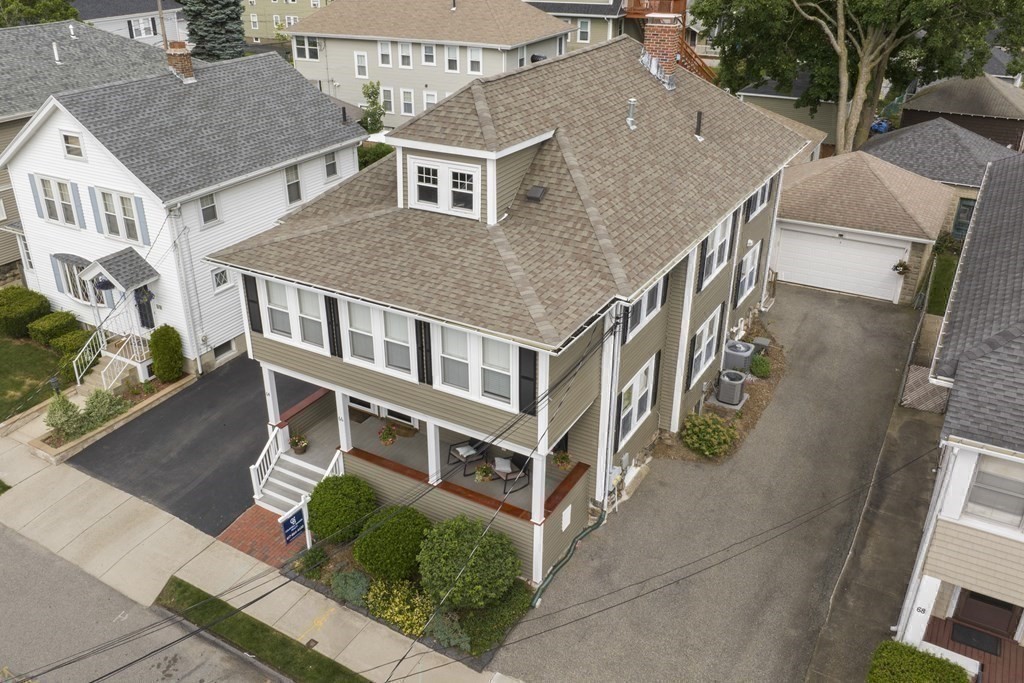 64 Parmenter Road, Unit 1 Waltham, MA 02453 - Photo 22 of 25 an aerial view of a house with a yard